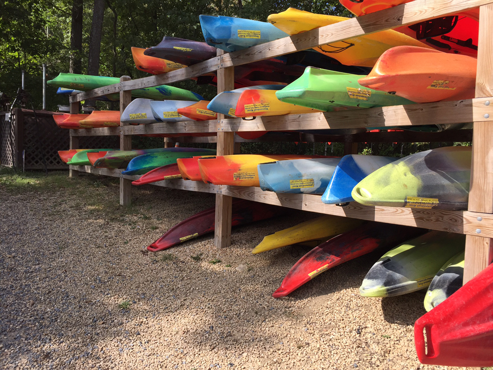 Rack of rental kayaks